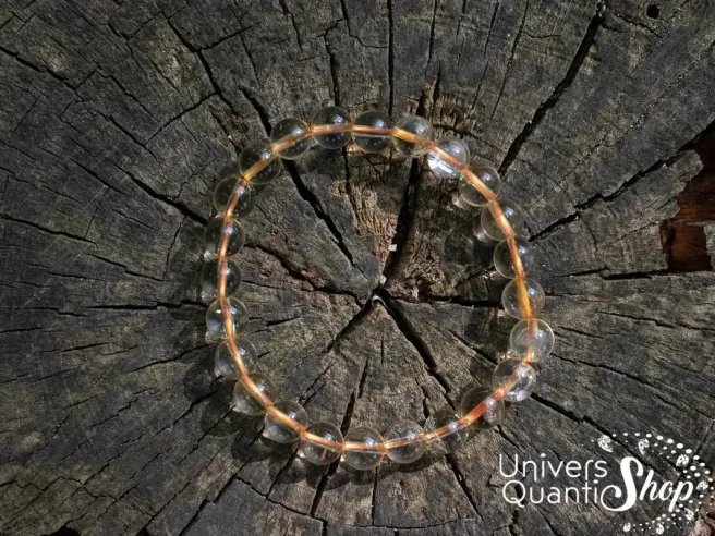 véritable citrine naturelle en bracelet 08mm de qualité AA sur du haut sur un tronc d'arbre
