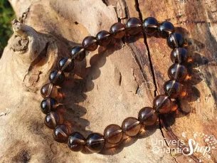 cristal de roche fumé vertus, bracelet quartz fumé 08mm sur du bois