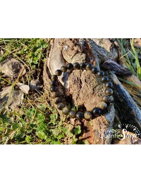 Obsidienne dorée bracelet en pierre naturelle 08mm sur une racine d'arbre en nature Obsidienne dorée bracelet en pierre naturelle 08mm sur une racine d'arbre en nature