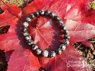 Obsidienne flocon de neige bracelet pierre noire et blanche 08mm sur une feuille